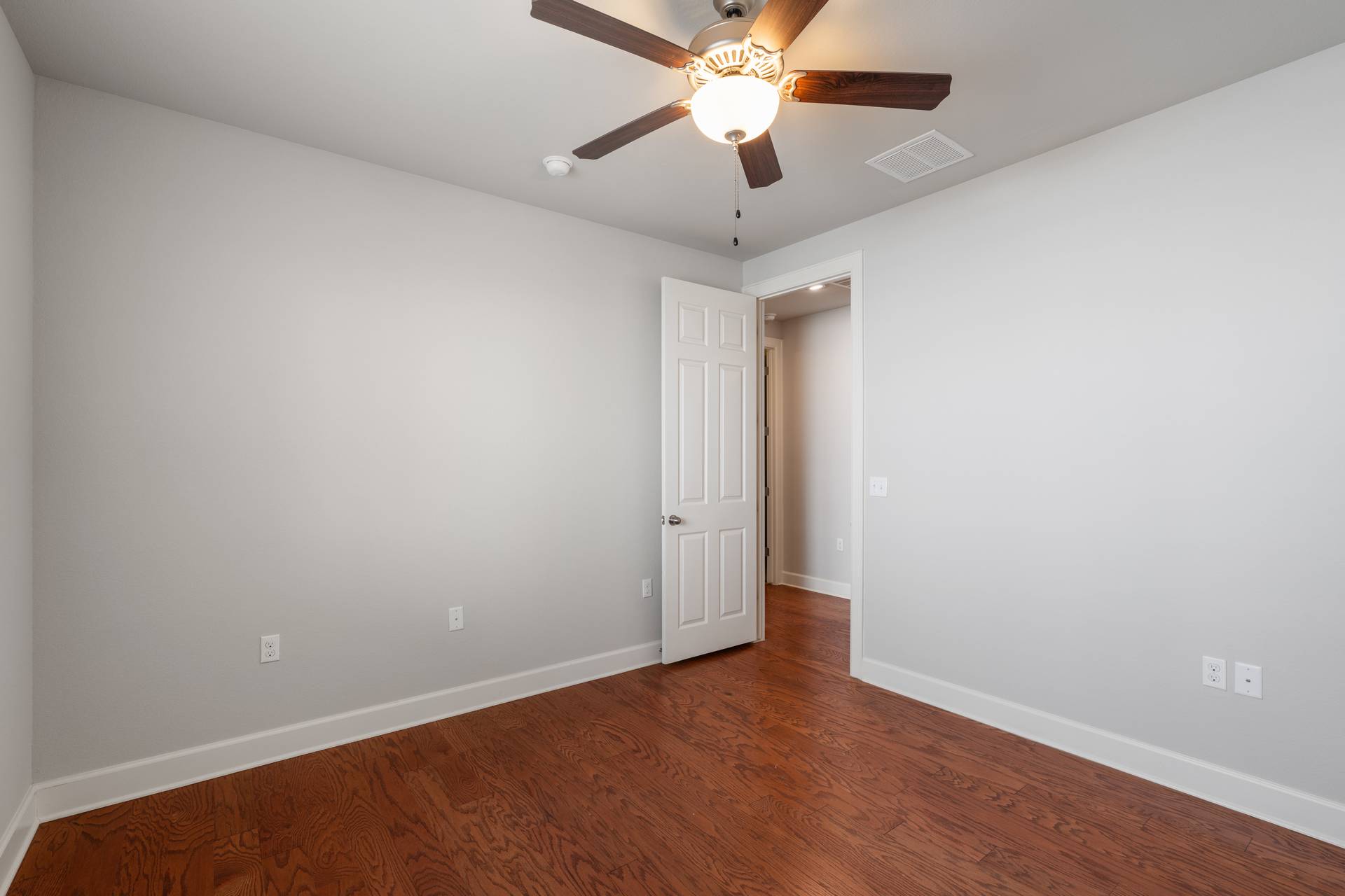 3516 Venezia View Leander, TX 78641 - Photo 17 of 40 Empty room featuring dark wood finished floors and ceiling fan