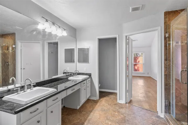 a view of room with window and ceiling fan