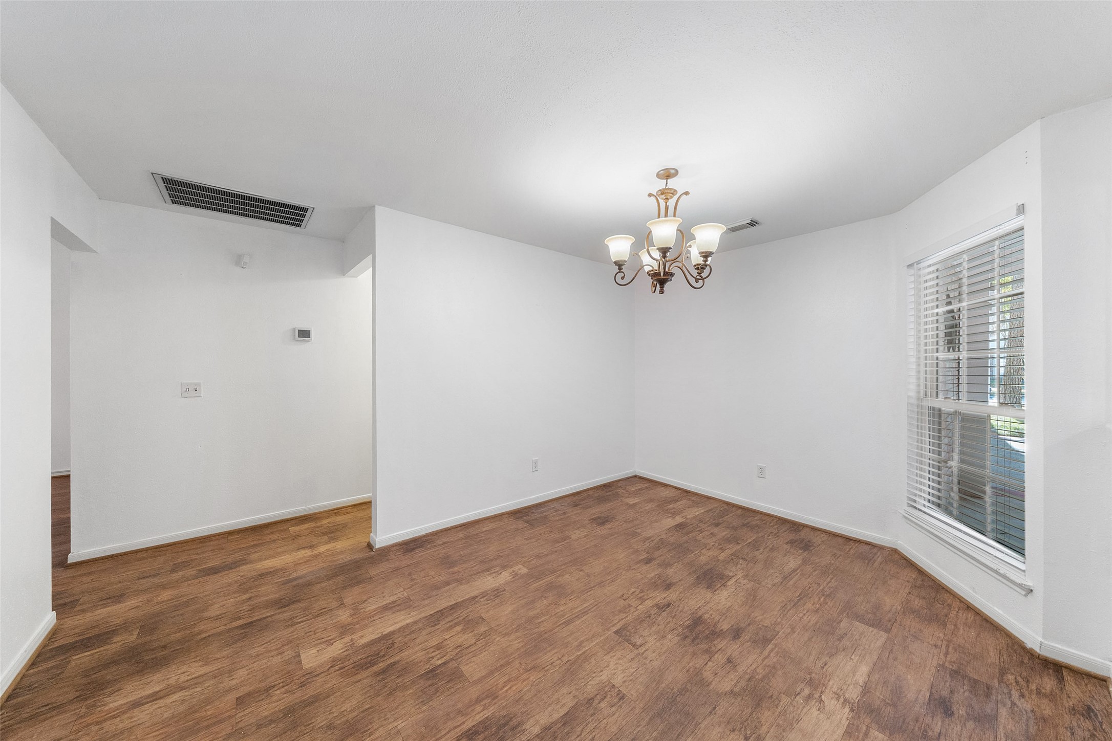 107 Sandpebble Drive The Woodlands, TX 77381 - Photo 26 of 30 a view of empty room with wooden floor