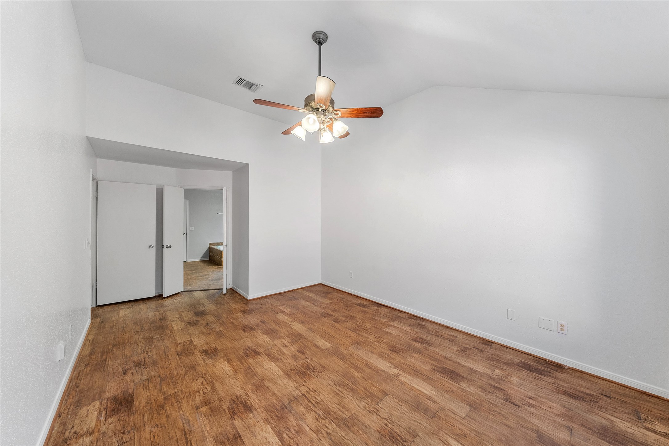 107 Sandpebble Drive The Woodlands, TX 77381 - Photo 27 of 30 a view of a room with a ceiling fan and a window