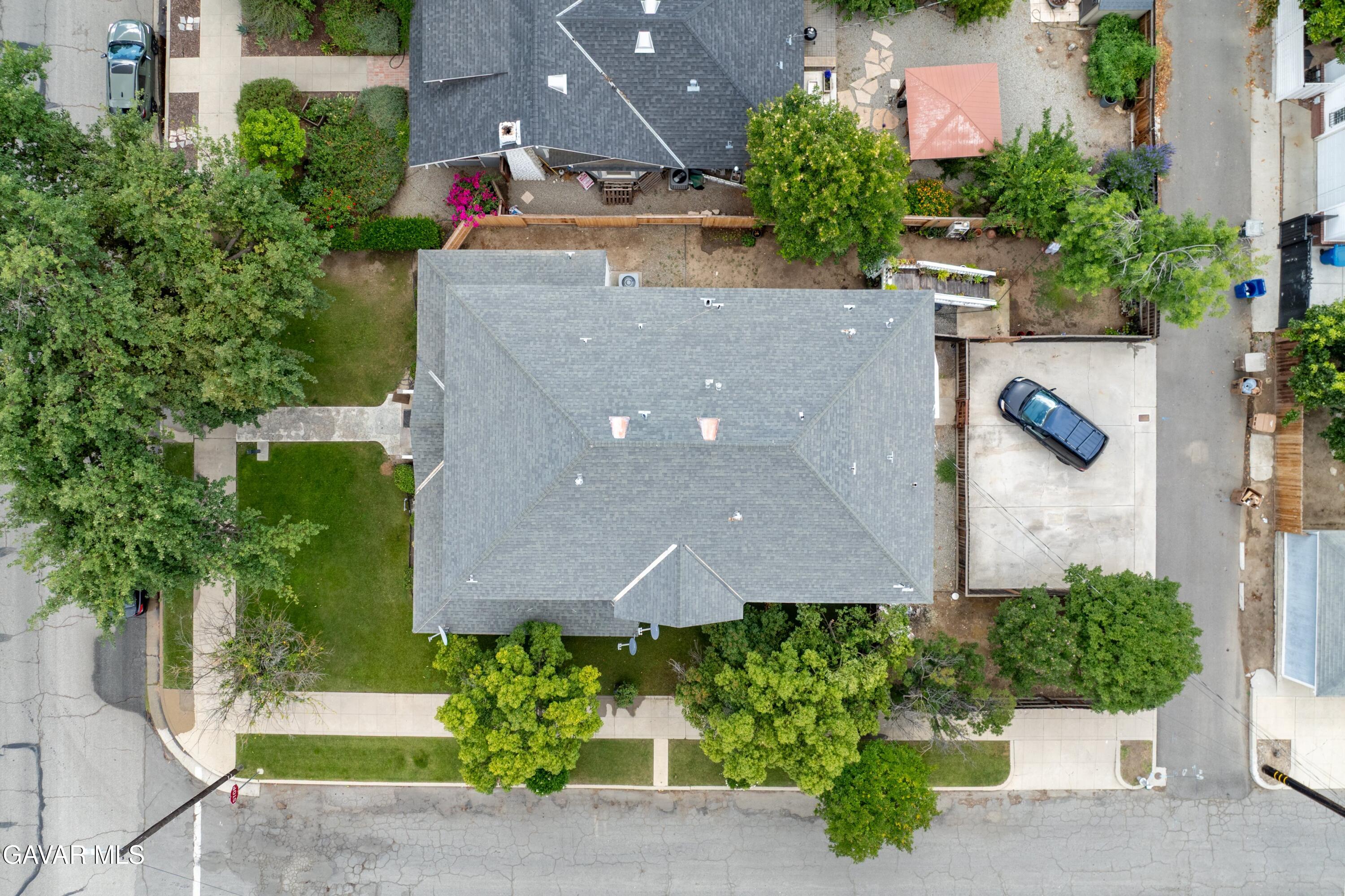 2702 19th Street Bakersfield, CA 93301 - Photo 14 of 21 an aerial view of a house with a yard and garden