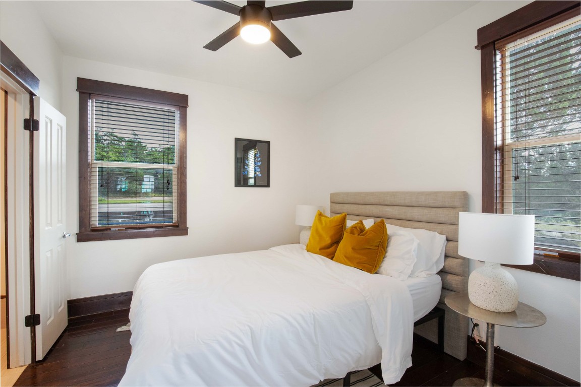 11209 Southwest Oaks Austin, TX 78737 - Photo 16 of 34 Bedroom featuring dark wood-type flooring and a ceiling fan