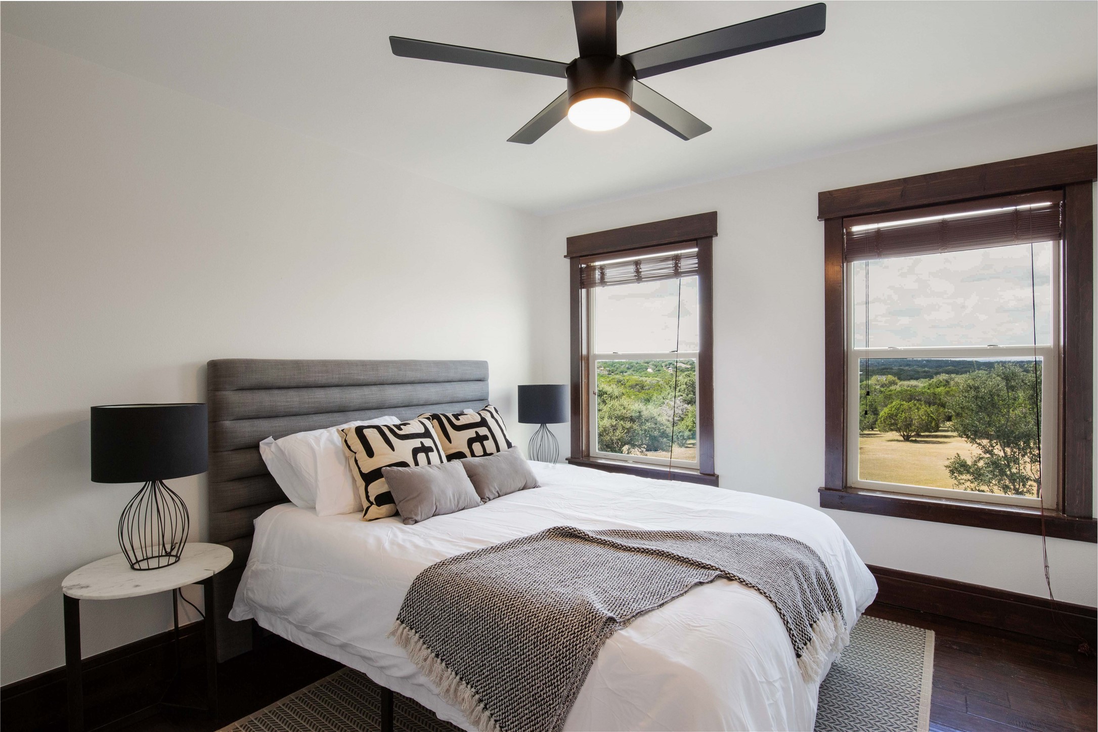 11209 Southwest Oaks Austin, TX 78737 - Photo 18 of 34 Bedroom featuring a ceiling fan and wood finished floors