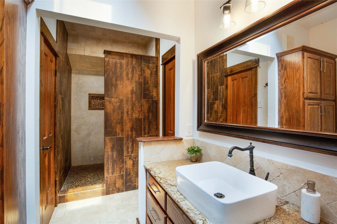 11209 Southwest Oaks Austin, TX 78737 - Photo 27 of 34 Bathroom featuring vanity and walk in shower
