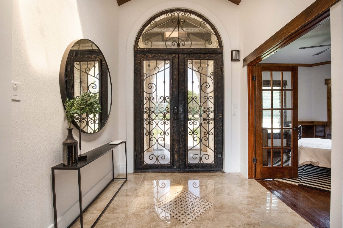 11209 Southwest Oaks Austin, TX 78737 - Photo 32 of 34 Foyer entrance with french doors and marble tiled floors