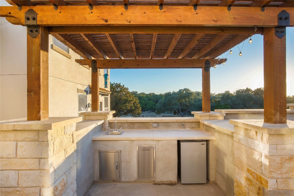 11209 Southwest Oaks Austin, TX 78737 - Photo 8 of 34 View of patio / terrace with area for grilling and a sink