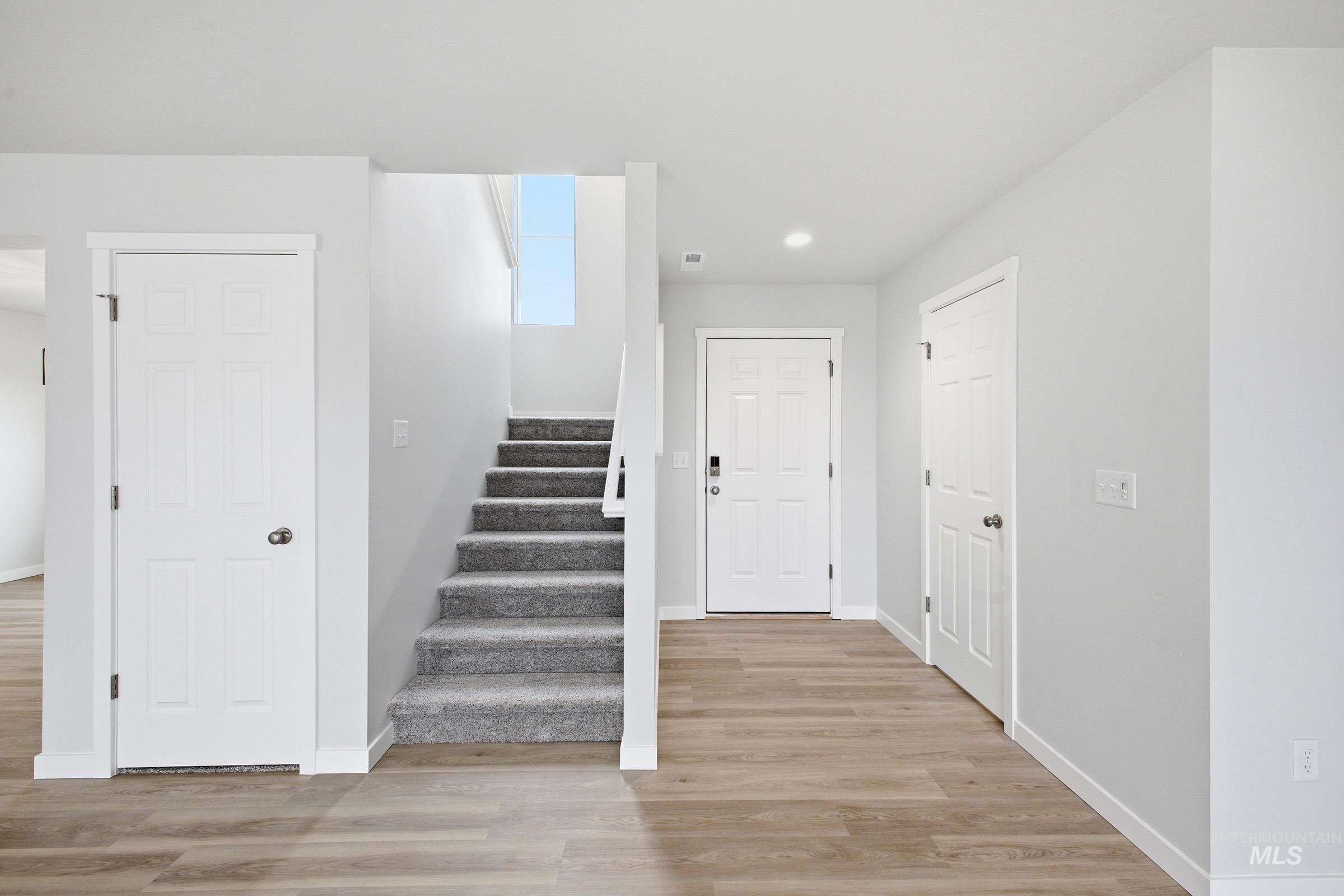 13718 Inman Court Caldwell, ID 83607 - Photo 2 of 20 Staircase with wood finished floors and recessed lighting