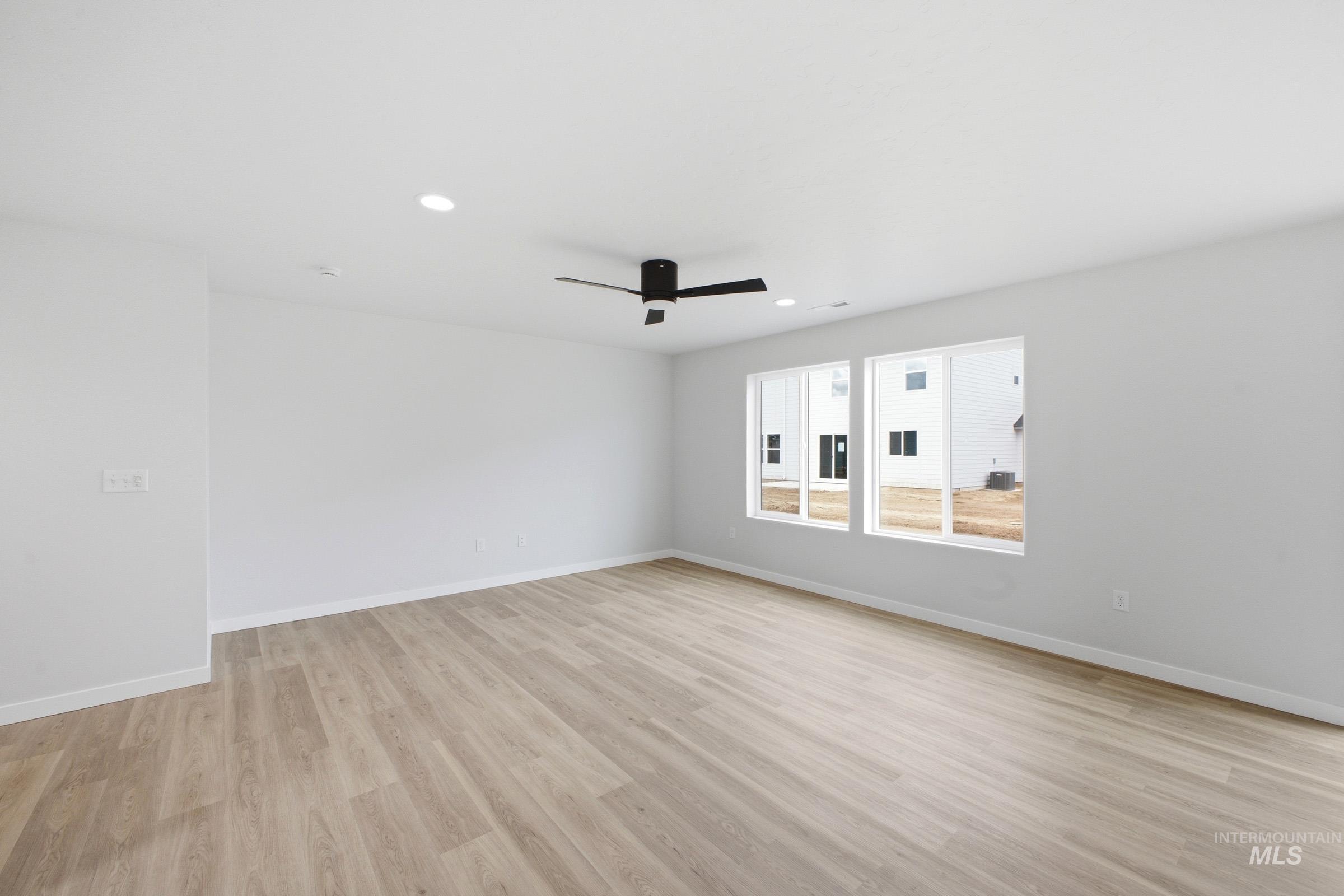 13718 Inman Court Caldwell, ID 83607 - Photo 8 of 20 Spare room with light wood-type flooring, a ceiling fan, and recessed lighting