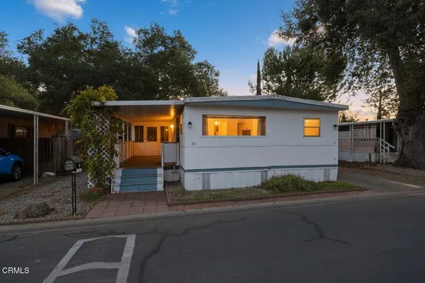 a view of a house with a street