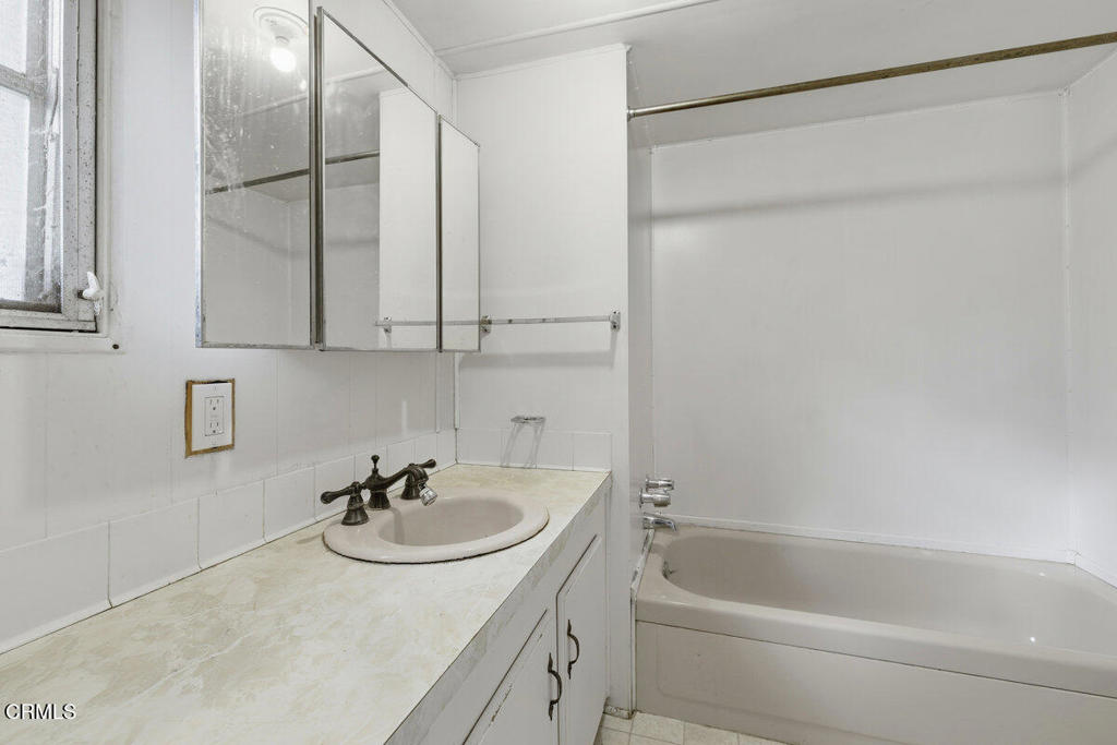 1225 South Rice Road, Unit 41 Ojai, CA 93023 - Photo 19 of 38 a bathroom with a sink and a bathtub with shower