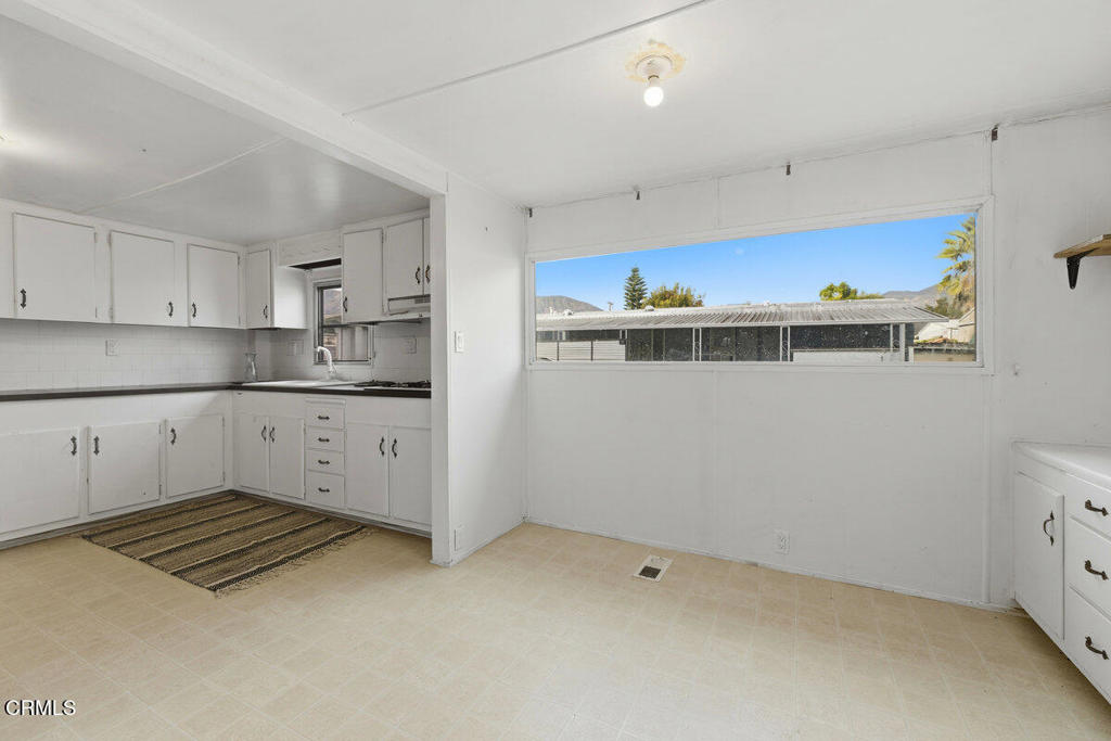 1225 South Rice Road, Unit 41 Ojai, CA 93023 - Photo 10 of 38 a kitchen with a cabinets and a stove top oven