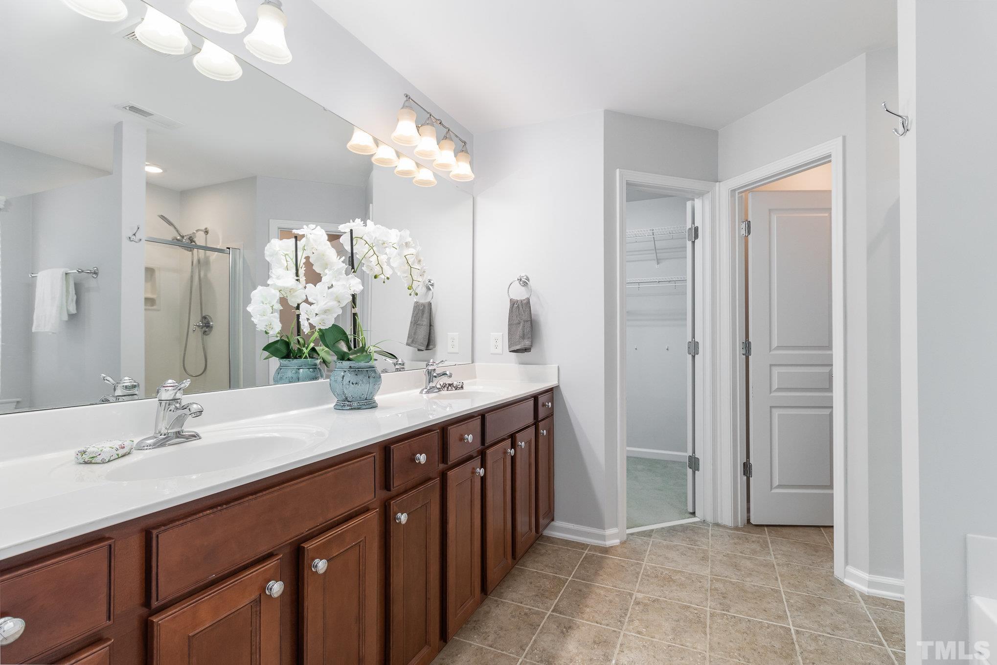 8220 Pilots View Drive Raleigh, NC 27617 - Photo 12 of 20 a spacious bathroom with a double vanity sink mirror and double