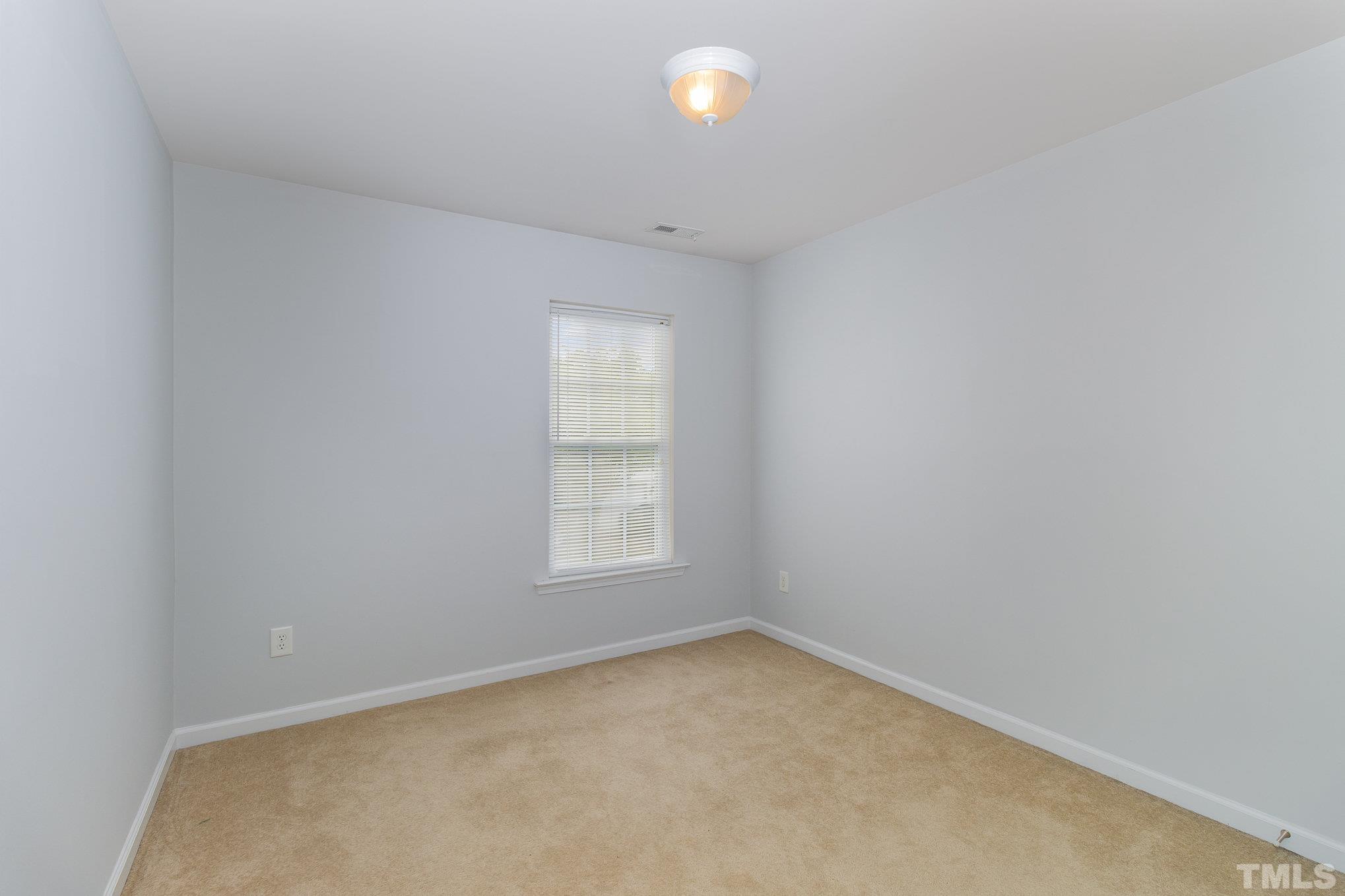 8220 Pilots View Drive Raleigh, NC 27617 - Photo 15 of 20 an empty room with a window