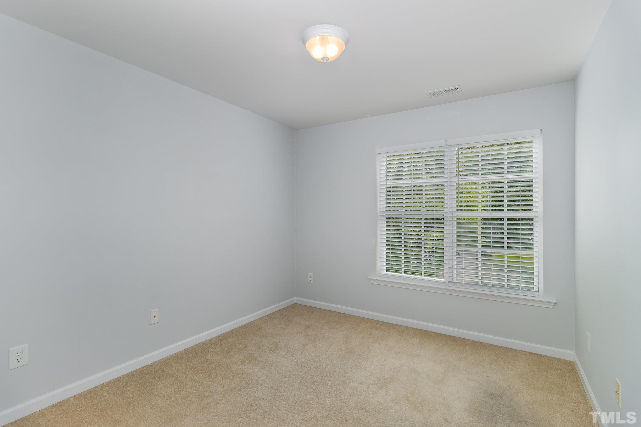 8220 Pilots View Drive Raleigh, NC 27617 - Photo 16 of 20 an empty room with a window