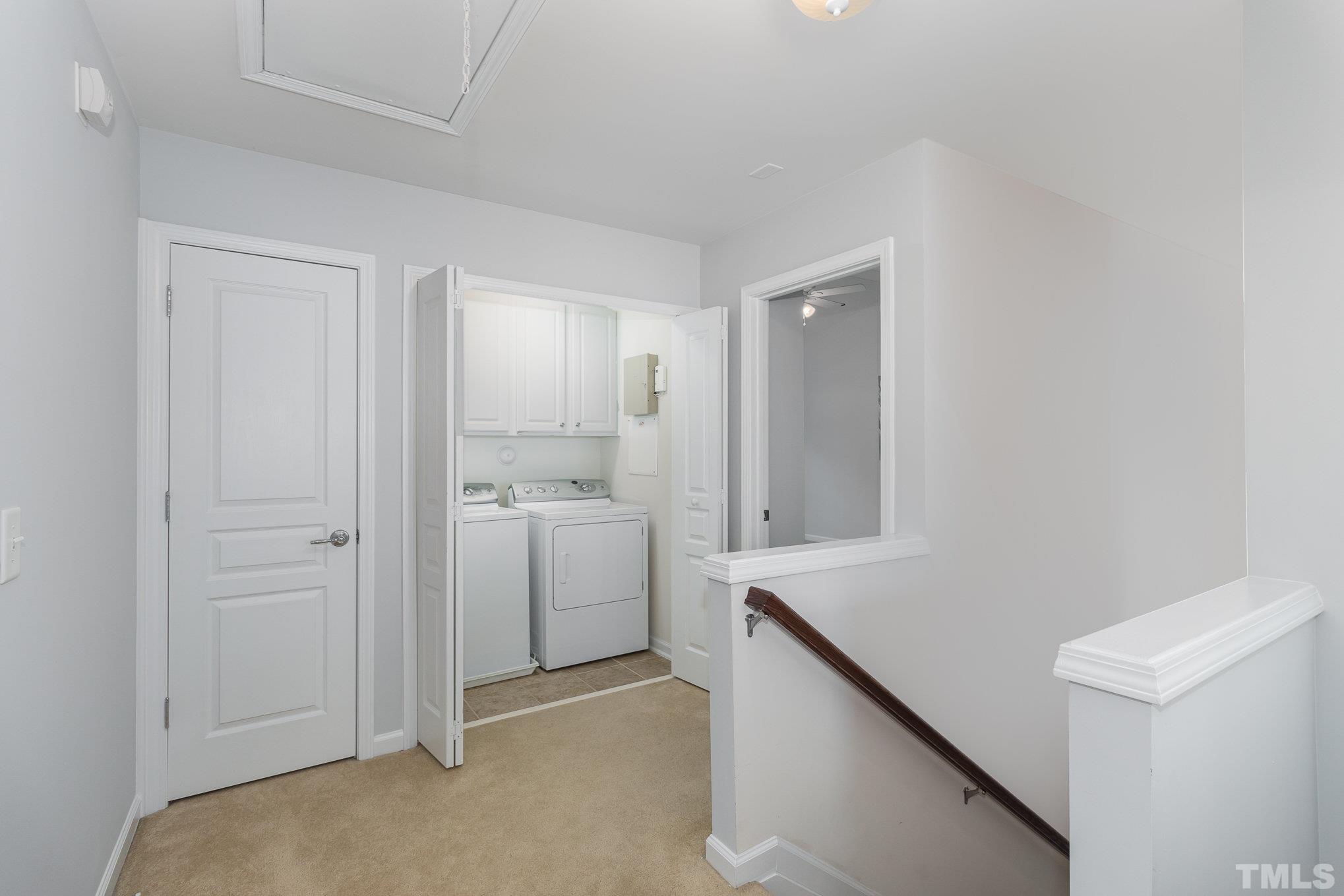 8220 Pilots View Drive Raleigh, NC 27617 - Photo 18 of 20 a view of hallway with washer and dryer