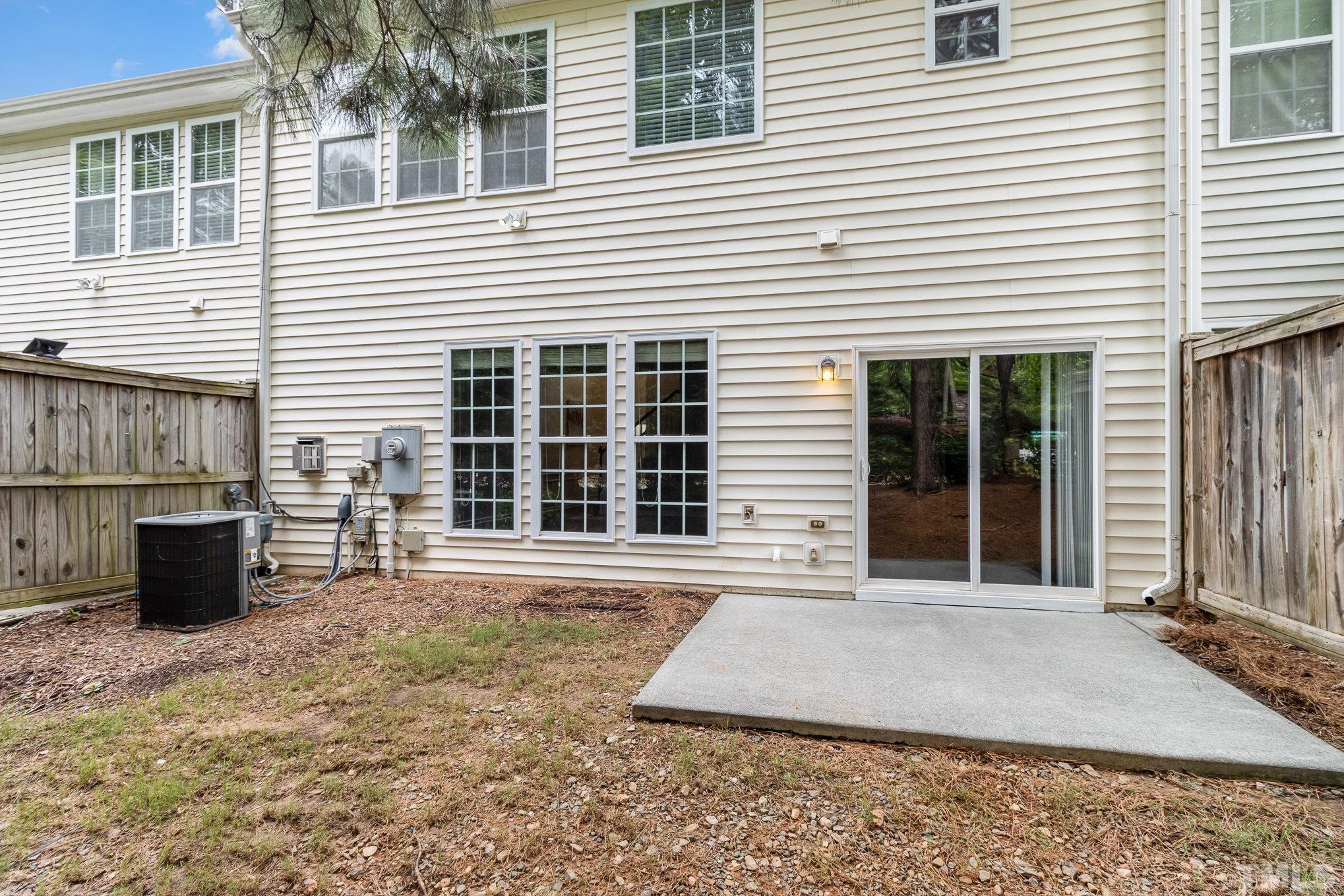 8220 Pilots View Drive Raleigh, NC 27617 - Photo 20 of 20 a front view of a house with a large window