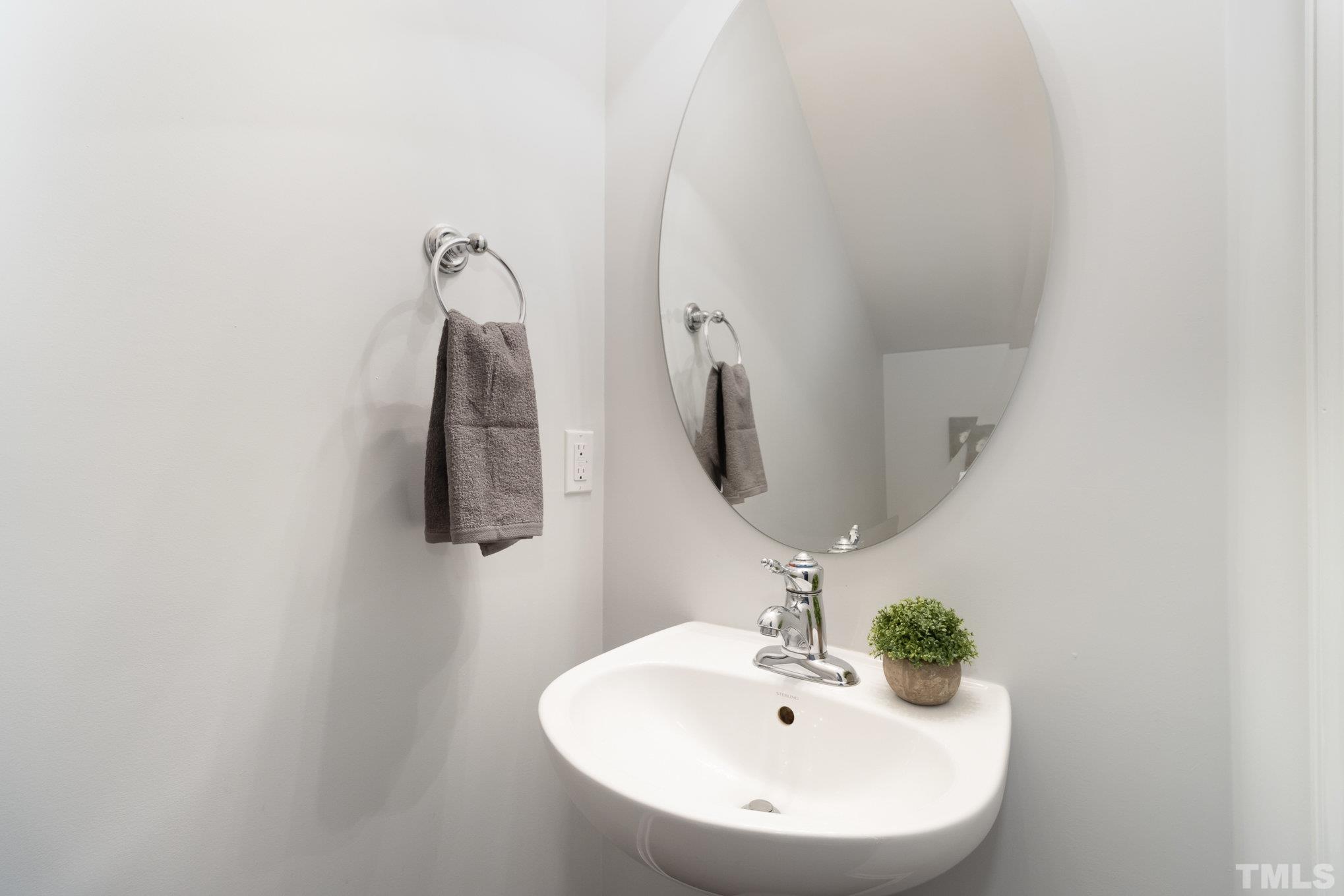8220 Pilots View Drive Raleigh, NC 27617 - Photo 9 of 20 a bathroom with a sink and a mirror