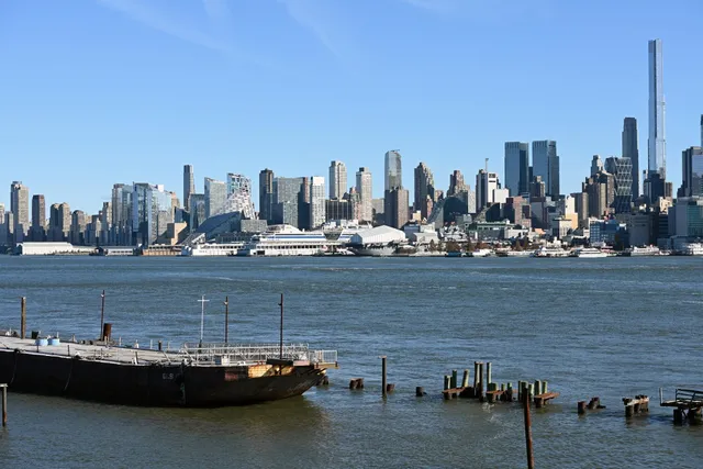 a view of a water with a tall building