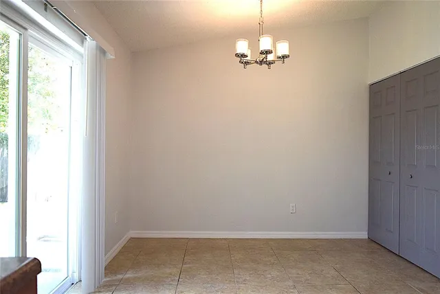 a view of a kitchen from the hallway