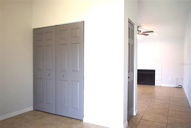 a kitchen with stainless steel appliances granite countertop a refrigerator a stove and a sink