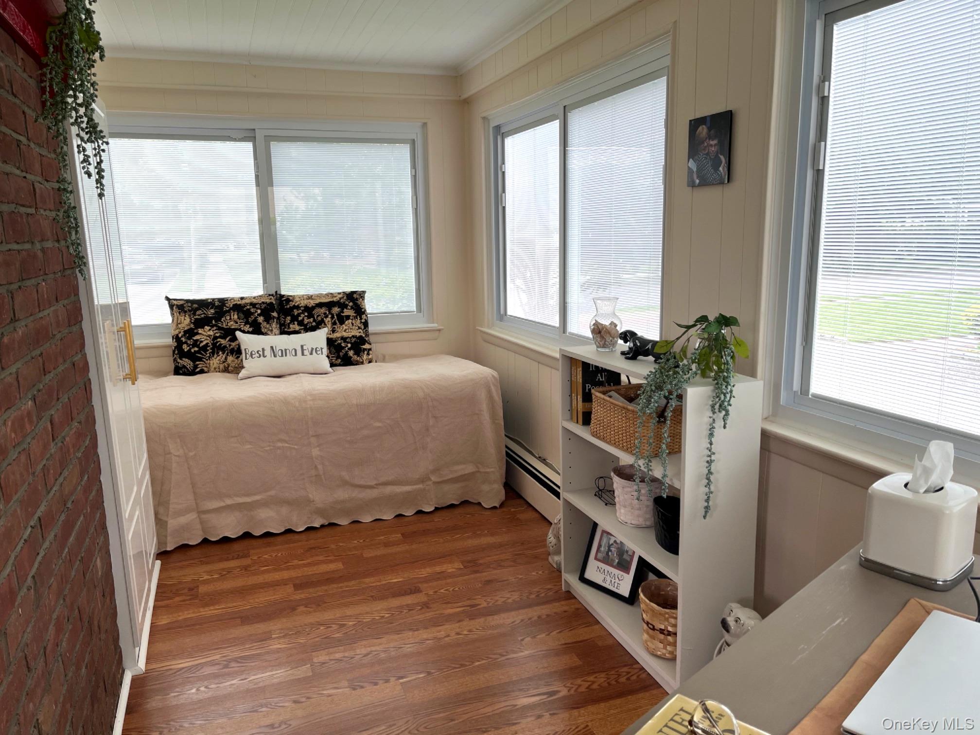 5 Newell Road Merrick, NY 11566 - Photo 10 of 19 a bedroom with a bed and a large window