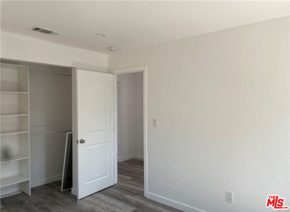 328 West Elm Street Compton, CA 90220 - Photo 11 of 12 a view of hallway with wooden floor