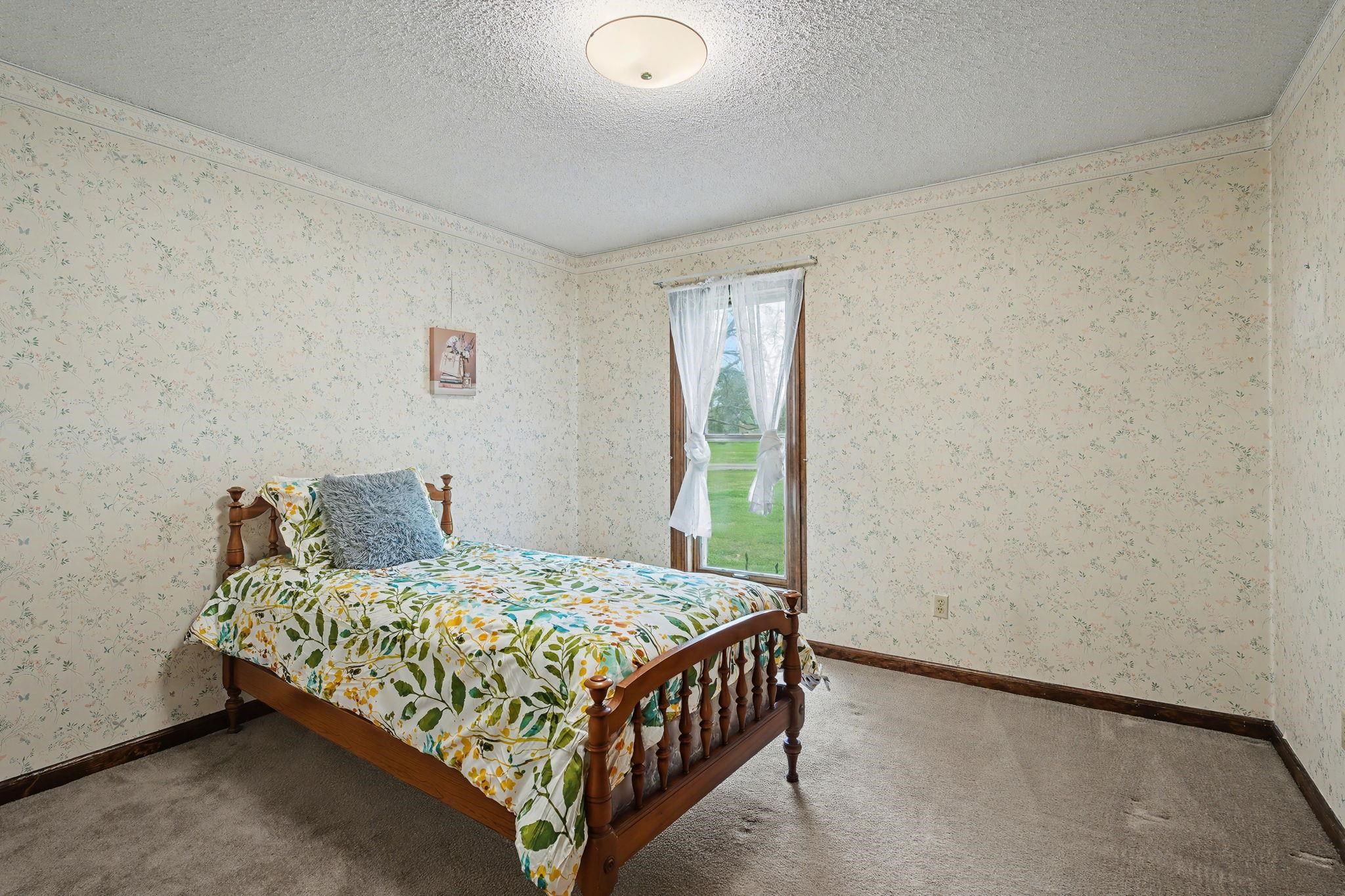 11380 Sycamore Farms Road Collierville, TN 38017 - Photo 28 of 38 Bedroom featuring carpet flooring, a textured ceiling, and wallpapered walls