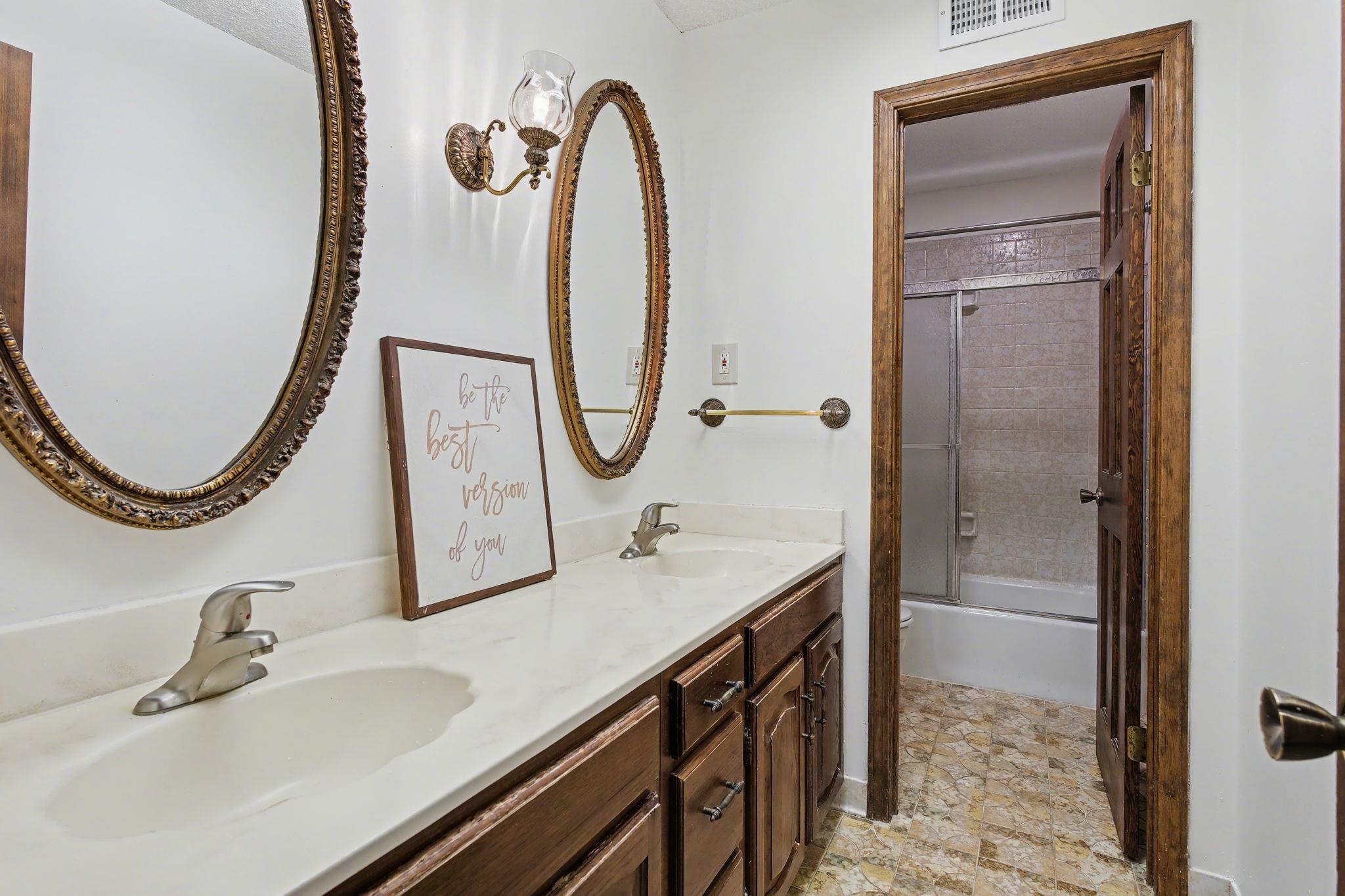 11380 Sycamore Farms Road Collierville, TN 38017 - Photo 29 of 38 Full bath featuring double vanity, combined bath / shower with glass door, and light stone finish floors