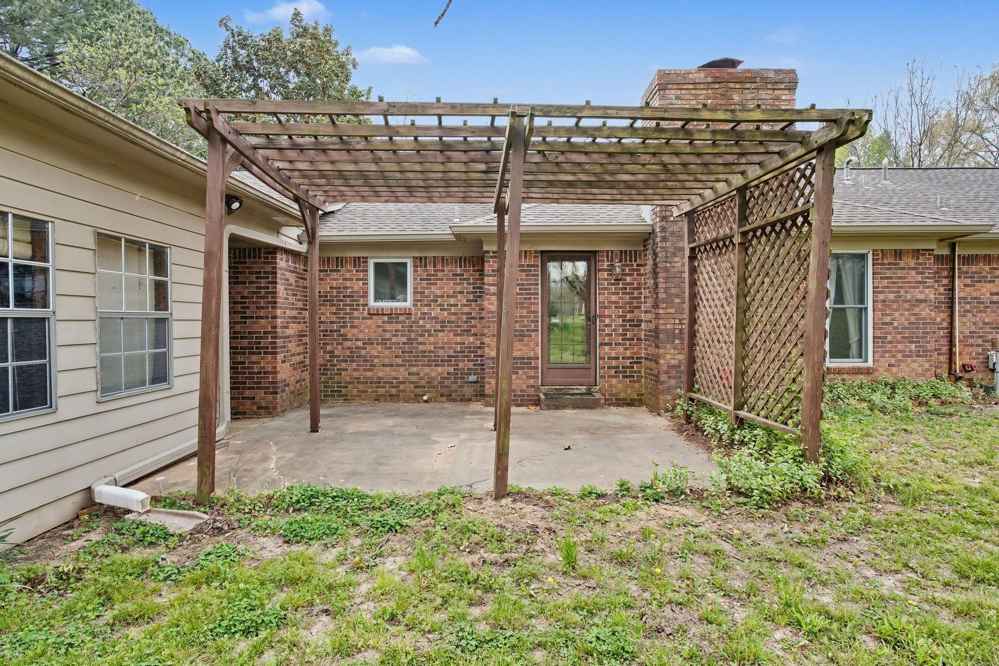 11380 Sycamore Farms Road Collierville, TN 38017 - Photo 30 of 38 Back of property featuring brick siding, a pergola, and a patio area