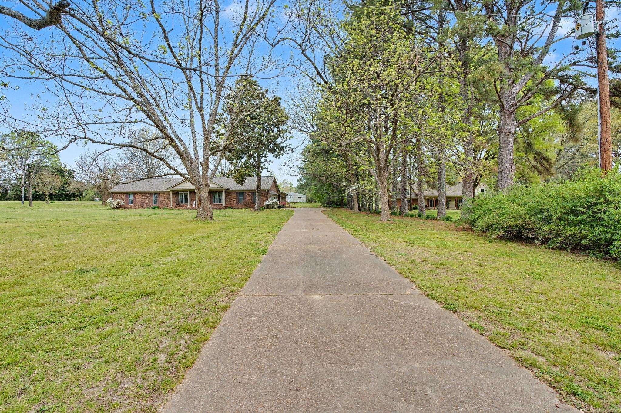 11380 Sycamore Farms Road Collierville, TN 38017 - Photo 4 of 38 View of front of home featuring a front lawn and brick siding