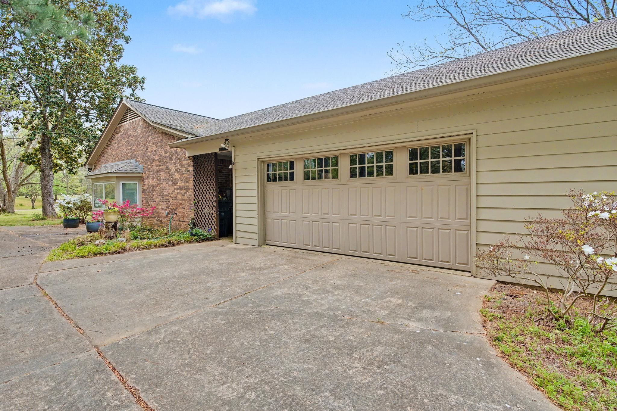 11380 Sycamore Farms Road Collierville, TN 38017 - Photo 6 of 38 Ranch-style house featuring driveway, roof with shingles, a garage, and brick siding