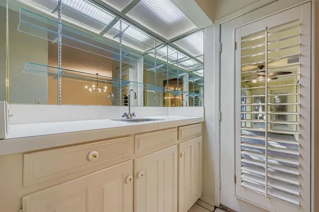 a bathroom with a shower and a sink