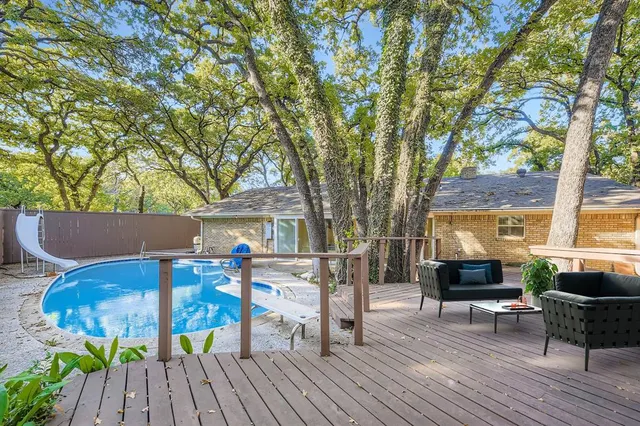 a view of a table and chairs in patio of the house