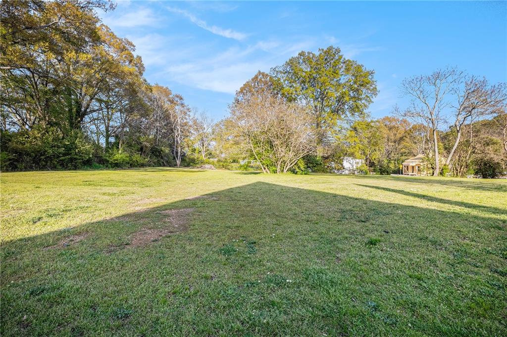 0 Davis Street Monroe, GA 30655 - Photo 3 of 6 a view of a field with an trees