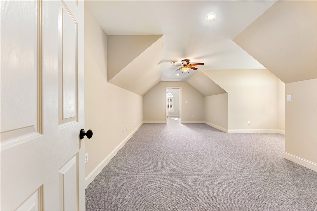 109 Limelight Drive Anderson, SC 29621 - Photo 27 of 34 This spacious room features vaulted ceilings, ample natural light, and plush carpeted flooring.