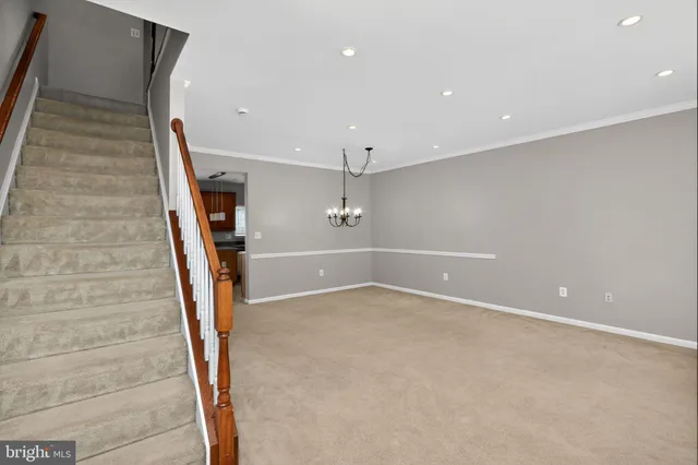 a view of an empty room with stairs