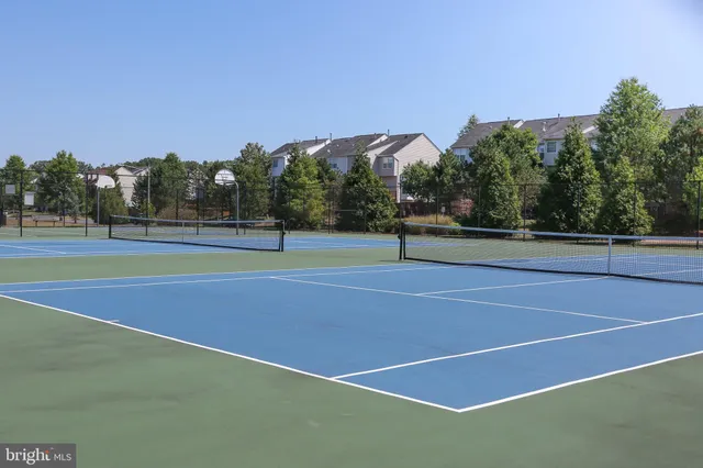 a view of an outdoor space and tennis court