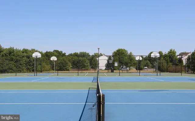 a view of a swimming pool with an outdoor seating and a yard