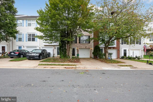 a view of street with parked cars