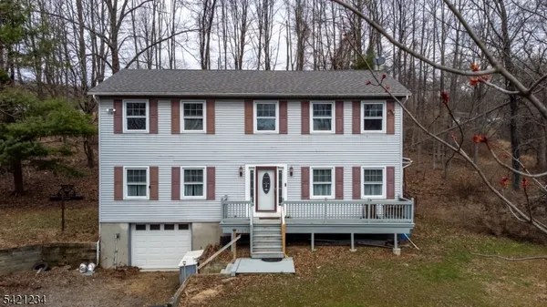 a house that has tree in front of it