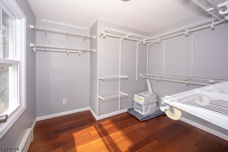 105 Valley Road Wantage, NJ 07461 - Photo 16 of 32 a view of a room with rack on the wall and a window