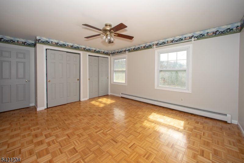 105 Valley Road Wantage, NJ 07461 - Photo 20 of 32 an empty room with windows and fan