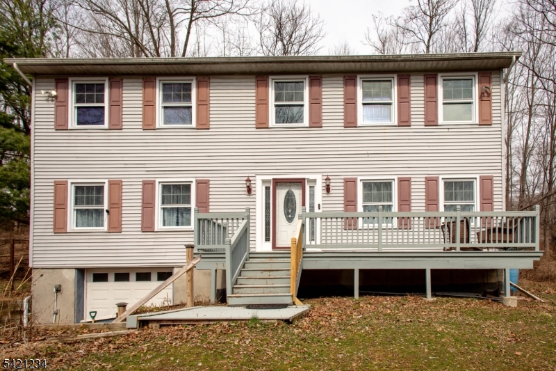 105 Valley Road Wantage, NJ 07461 - Photo 25 of 32 a front view of a house with a yard