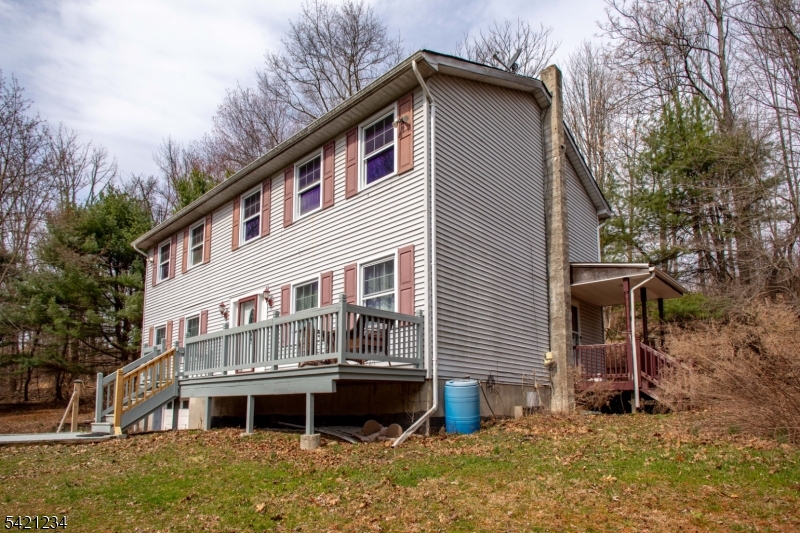 105 Valley Road Wantage, NJ 07461 - Photo 26 of 32 a view of a house with a yard and wooden fence
