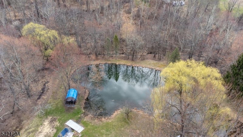 105 Valley Road Wantage, NJ 07461 - Photo 30 of 32 a view of a lake with a bench in the background