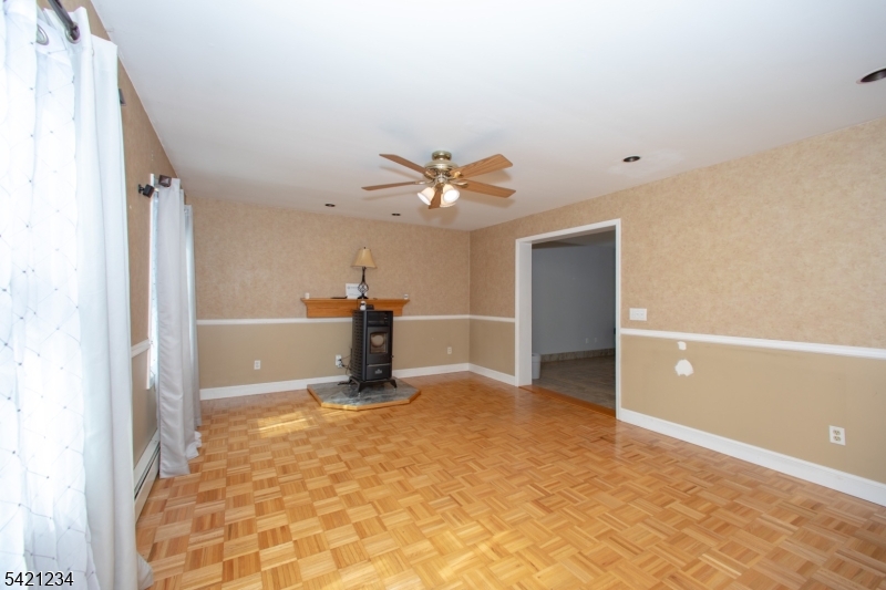 105 Valley Road Wantage, NJ 07461 - Photo 5 of 32 a view of a livingroom with a ceiling fan and window