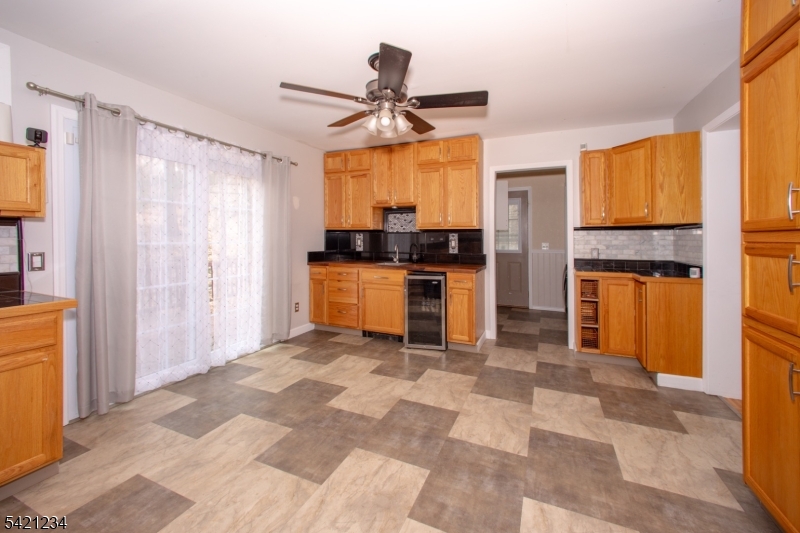105 Valley Road Wantage, NJ 07461 - Photo 9 of 32 a kitchen with stainless steel appliances granite countertop a refrigerator and a stove top oven