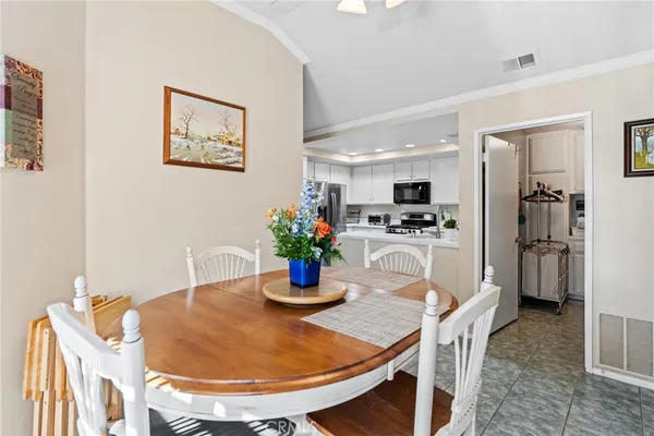 a dining room with furniture and window