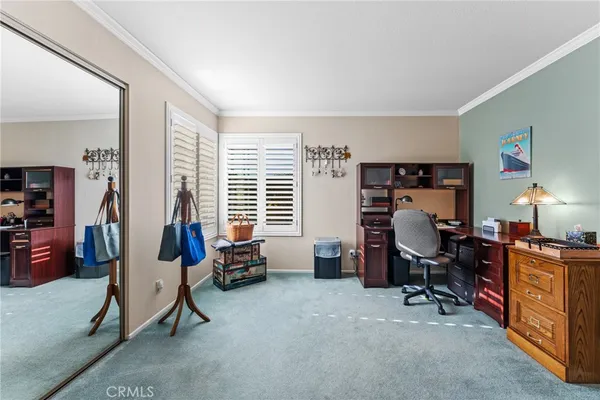 a bedroom with furniture and a window
