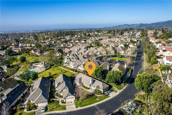 an aerial view of a house with a swimming pool